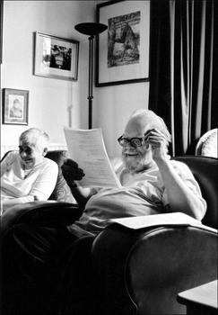 Philip Hobsbaum reading student work with his wife Rosemary in the background